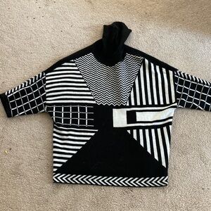 Madeline French Monochrome Geometric Turtleneck Sweater